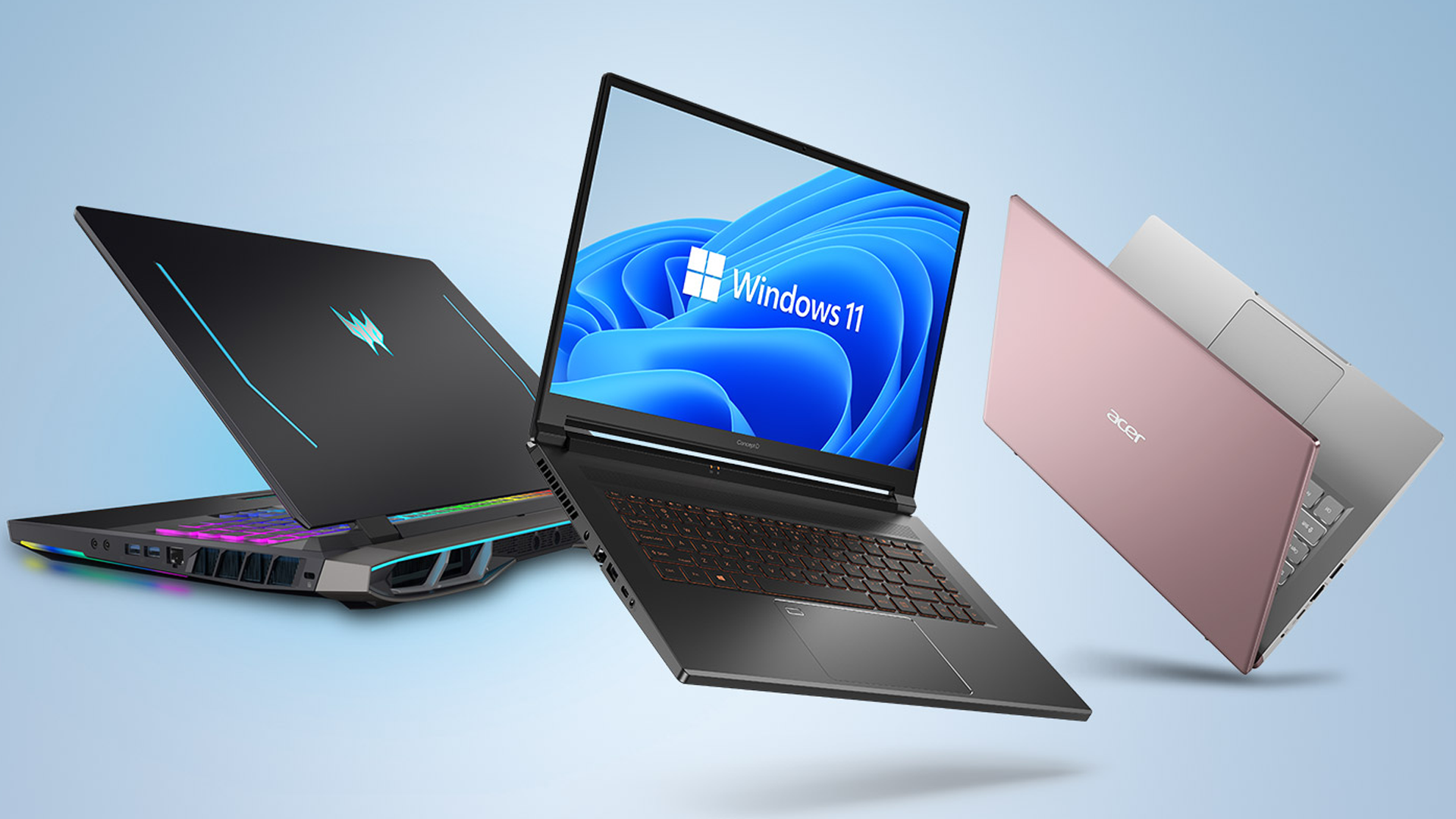 Tre laptop su uno schermo azzurro acceso con Windows 11.