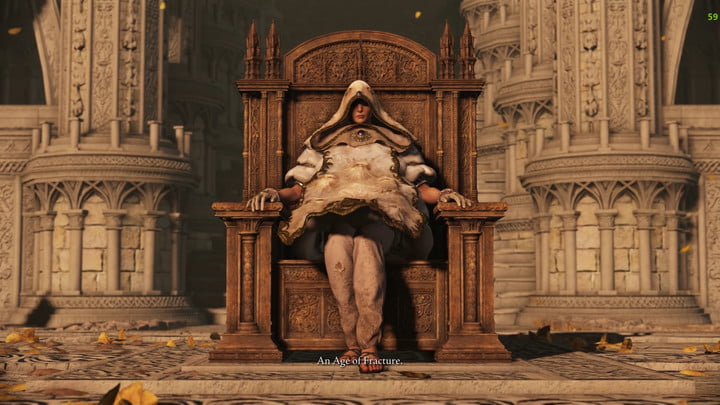 Una persona seduta su un trono con un grande cappotto.