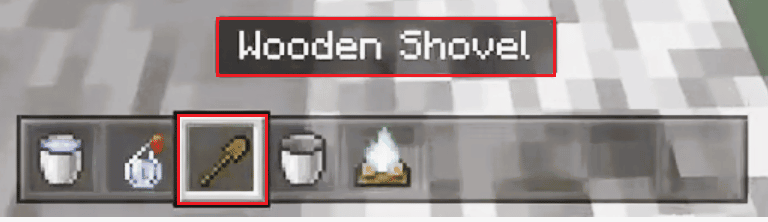 usa lo showel di legno per Minecraft estinguere Campfire